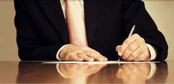 Signing document on table